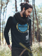 Man wearing a black sweatshirt with &