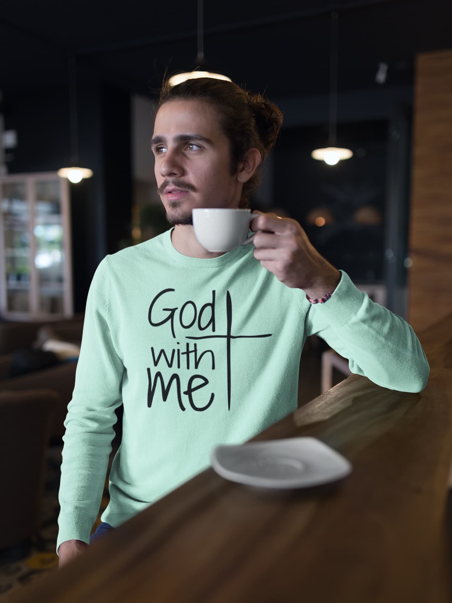 Man holding a cup with &