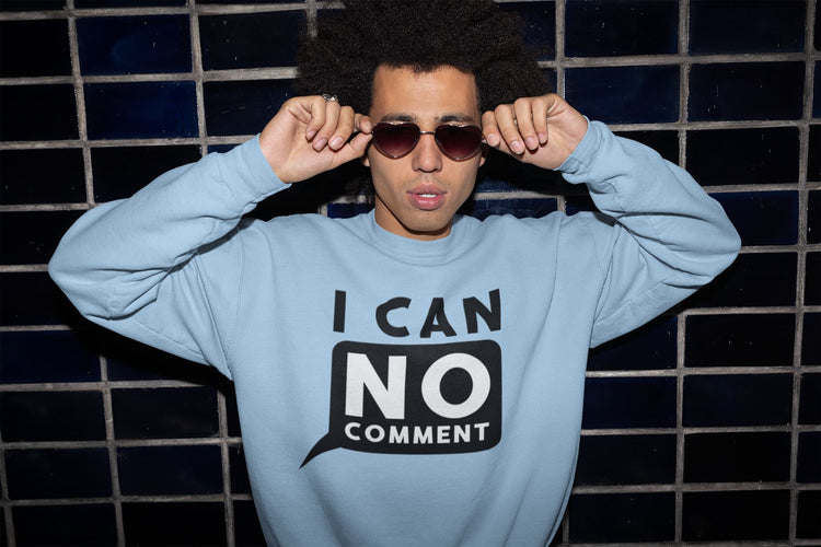 Person wearing a light blue sweatshirt with &