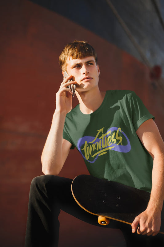 Person wearing a green t-shirt with a logo, holding a skateboard, against a blurred background