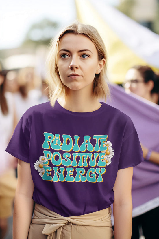 Person wearing a purple t-shirt with &