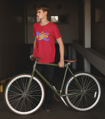 Man in a red t-shirt holding a green bicycle indoors