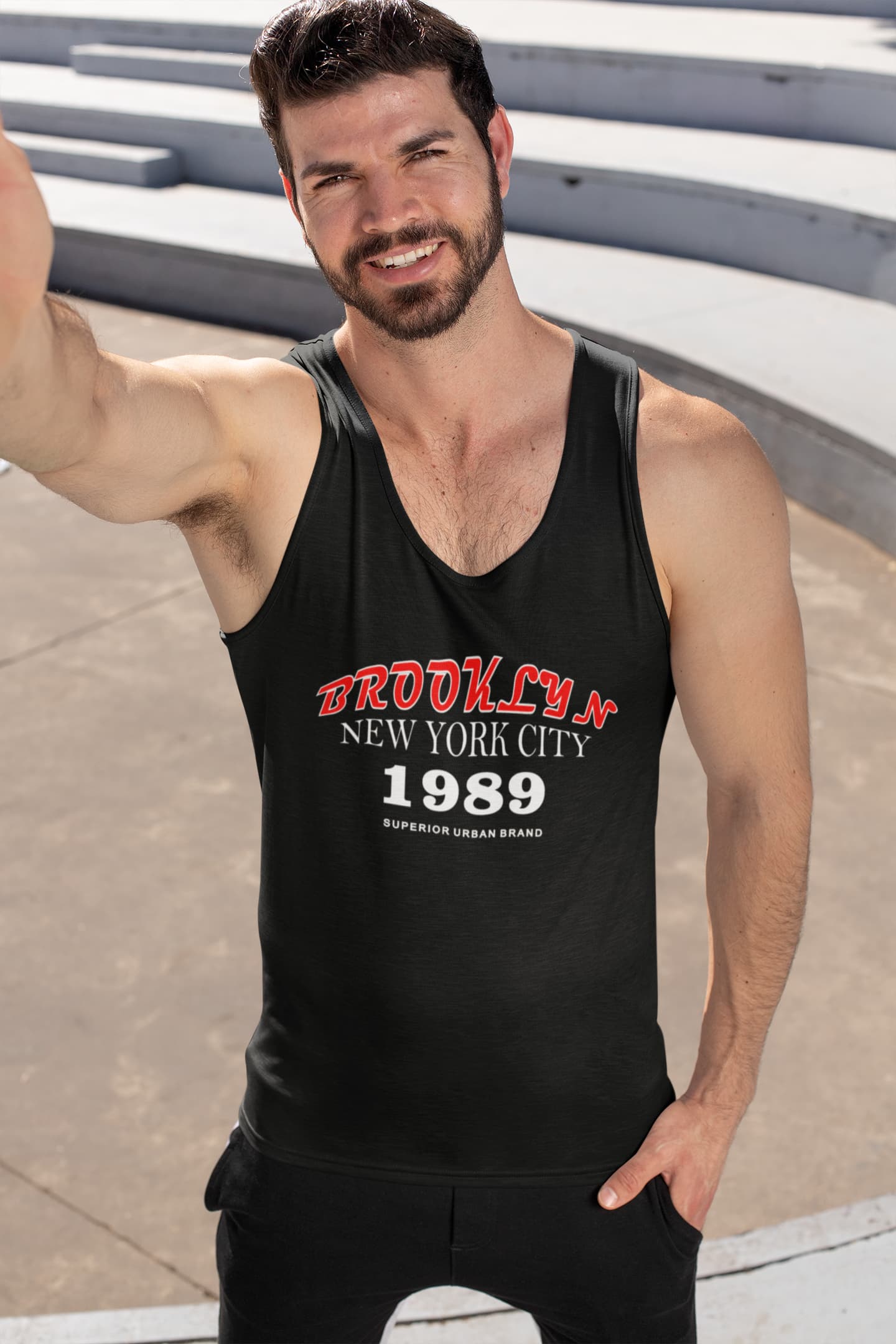 Man wearing a black tank top with &