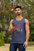 Man juggling a ball wearing a navy tank top with &