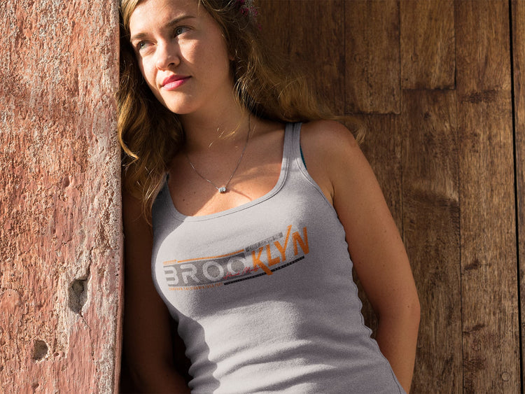 Woman wearing a tank top with &