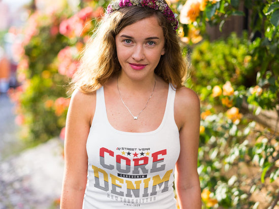 Woman wearing a white tank top with &