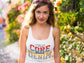 Woman wearing a white tank top with &