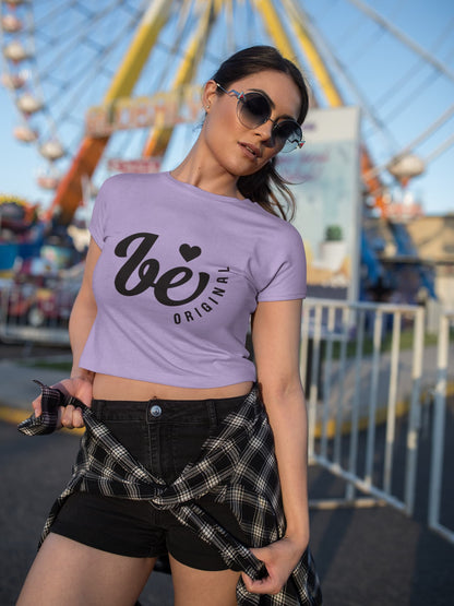 Woman wearing a purple t-shirt with text at an amusement park