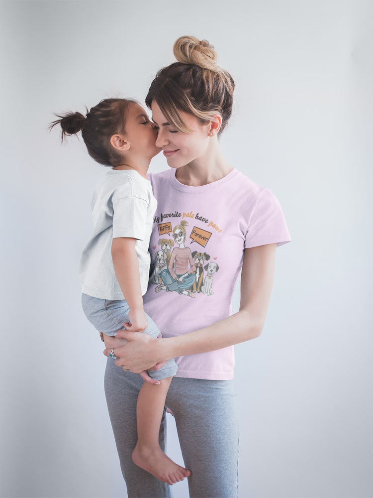 Woman holding a child against a plain background